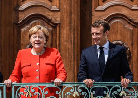 Angela Merkel e Emmanuel Macron © EPA