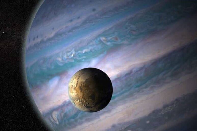 Rappresentazione artistica di una esoluna in orbita intorno a un pianeta gassoso gigante (fonte: NASA GSFC, JayFriedlander e Britt Griswold) - RIPRODUZIONE RISERVATA