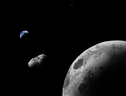 Rappresentazione artistica del quasi-satellite della Terra Kamo`oalewa. Potrebbe essere un frammento della Luna (fonte: Addy Graham/University of Arizona) (ANSA)