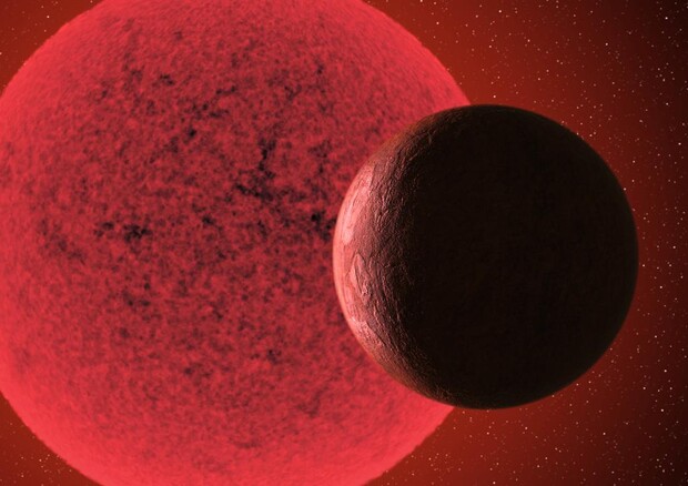 Rappresentazione artistica di una super-Terra in orbita intorno a una nana rossa (fonte: Gabriel Pérez Díaz, SMM/IAC) © Ansa