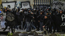 Scontri a Milano durante il corteo degli anarchici per Cospito (ANSA)