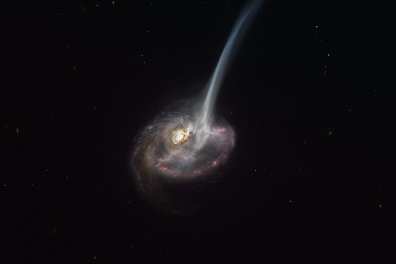 Rappresentazione artistica della galassia ID2299, nata da una collisione cosmica (fonte: ESO/M. Kornmesser) - RIPRODUZIONE RISERVATA